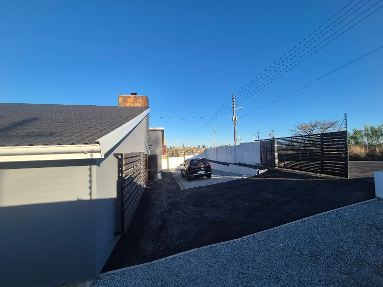 Exterior of the AMP-INC practice with its gated driveway
